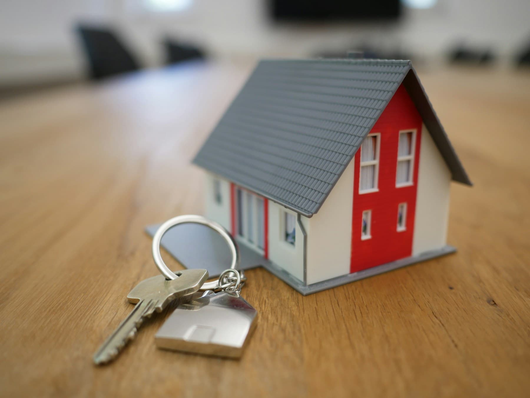 House keys beside a model home